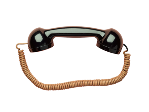 Black vintage phone handset with coiled cord against a dark background