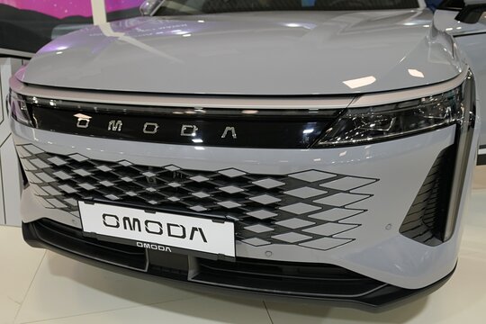 Left front view of chinese mid-size crossover SUV vehicle Chery Omoda 9 Premium, rebadged Exeed Yaoguang or RX, white metallic chassis color, displayed on car expo in Nitra, Slovakia, october 2025. 
