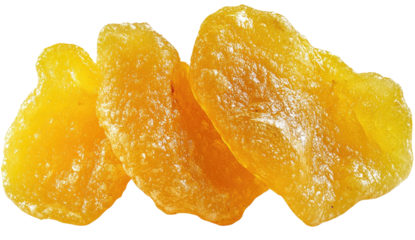 Three pieces of candied fruit, textured and yellow-orange, on black backdrop