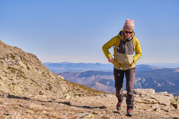 Woman walking alone in the mountains