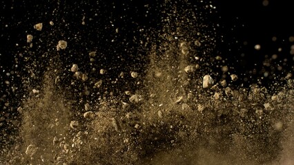 Freeze Motion Shot of Flying Soil , Isolated on Black Background