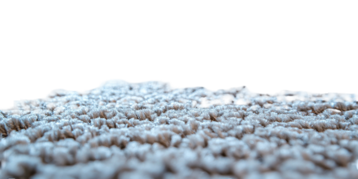 Beige textured surface with varied peaks, fading to black