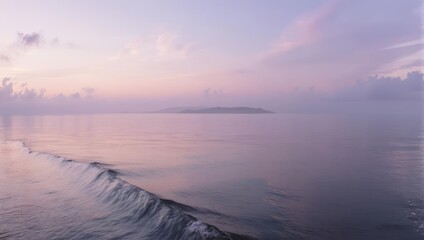 Serene ocean landscape at dawn, reflecting soft pastel hues across a calm, open expanse