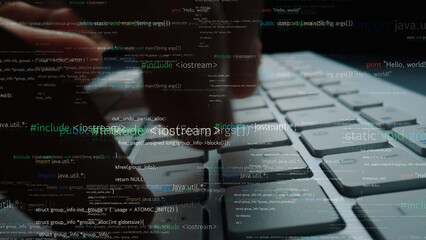 A close-up image captures a hand typing on a laptop keyboard with programming code overlay, symbolizing the integration of technology and digital communication. Xenic
