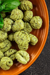 Gnocchi spinach potato dough second course portion size natural product tasty snack fresh delicious gourmet food background on the table rustic top view copy space