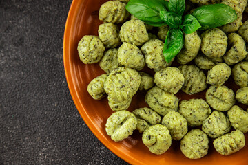 Gnocchi spinach potato dough second course portion size natural product tasty snack fresh delicious gourmet food background on the table rustic top view copy space