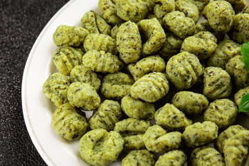 Gnocchi spinach potato dough second course portion size natural product tasty snack fresh delicious gourmet food background on the table rustic top view copy space