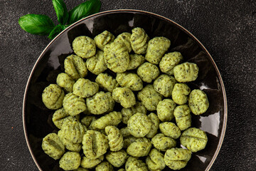 Gnocchi spinach potato dough second course portion size natural product tasty snack fresh delicious gourmet food background on the table rustic top view copy space