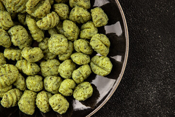Gnocchi spinach potato dough second course portion size natural product tasty snack fresh delicious gourmet food background on the table rustic top view copy space