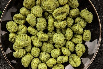 Gnocchi spinach potato dough second course portion size natural product tasty snack fresh delicious gourmet food background on the table rustic top view copy space