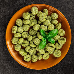 Gnocchi spinach potato dough second course portion size natural product tasty snack fresh delicious gourmet food background on the table rustic top view copy space