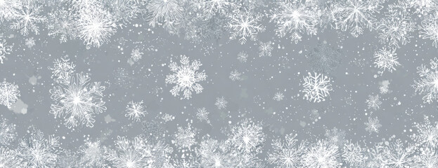 Snowflake background with a silver hue winter holiday season perfect for banners and festive designs