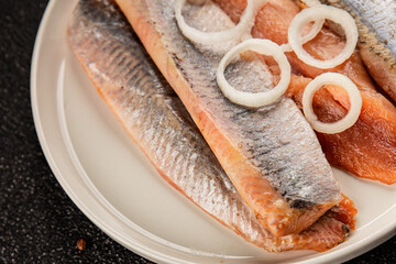 Herring fillet fish fresh seafood portion size natural product tasty snack fresh delicious gourmet food background on the table rustic top view copy space pescetarian diet