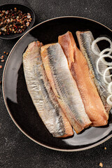 Herring fillet fish fresh seafood portion size natural product tasty snack fresh delicious gourmet food background on the table rustic top view copy space pescetarian diet