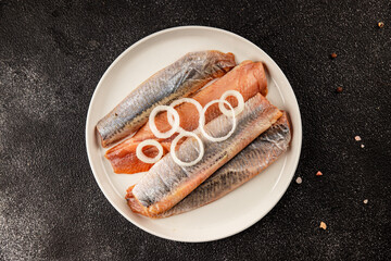 Herring fillet fish fresh seafood portion size natural product tasty snack fresh delicious gourmet food background on the table rustic top view copy space pescetarian diet