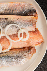 Herring fillet fish fresh seafood portion size natural product tasty snack fresh delicious gourmet food background on the table rustic top view copy space pescetarian diet