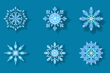 Collection of six detailed blue paper cut snowflakes on a turquoise background, perfect for winter decorations, Christmas graphics, and festive design projects.