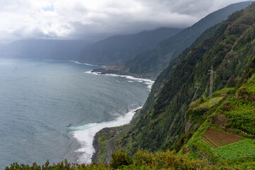 View of green mountains and Atlantic coast of Madeira in Miradouro da Eira da Achada