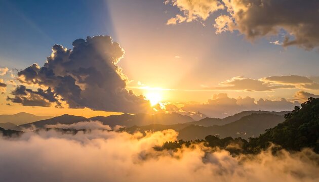 Golden sunset over misty mountains