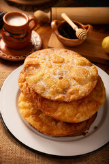 Mexican Buñuelos. Traditionally fried wheat tortillas used for Christmas and winter holidays, these are fried flour tortillas sprinkled with sugar or covered in a syrup made with piloncillo, cinnamon,