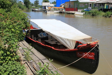 black boat with striking red trim
