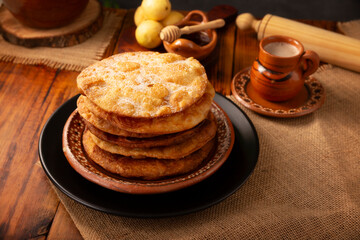 Mexican Buñuelos. Traditionally fried wheat tortillas used for Christmas and winter holidays, these are fried flour tortillas sprinkled with sugar or covered in a syrup made with piloncillo, cinnamon,