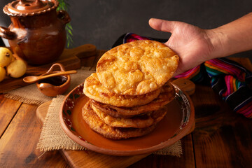 Mexican Buñuelos. Traditionally fried wheat tortillas used for Christmas and winter holidays, these are fried flour tortillas sprinkled with sugar or covered in a syrup made with piloncillo, cinnamon,