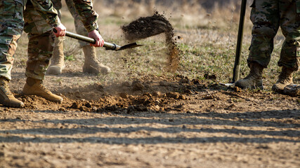Fototapeta premium Soldiers Shovel Dirt