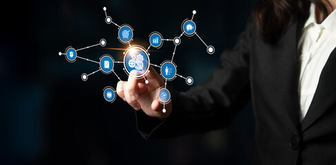 A dynamic business professional engages with a modern digital interface showcasing technology icons, symbolizing innovation and data analysis in a sleek workspace. Tessel