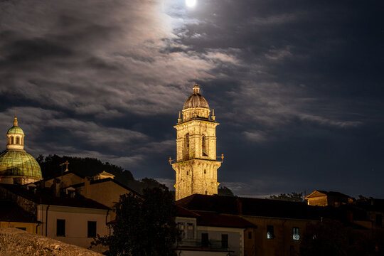 illuminated bell tower in italian typical medieval village