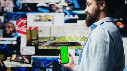 Male web user navigates phone with copy space for social media platforms, showcasing creativity and mobile technology to ensure online connection for entertaining activity. Camera B.