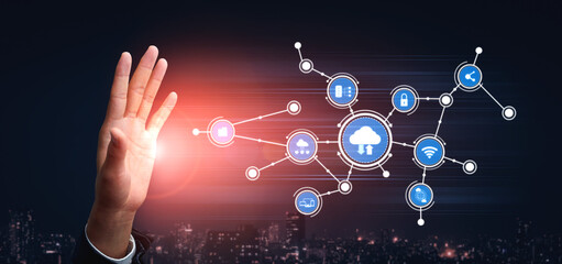A hand reaching toward a dynamic cloud technology interface showcases a network of digital icons symbolizing the Internet of Things and smart technology advancements. Tessel