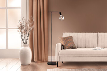 Modern interior design featuring a cozy sofa, stylish floor lamp, and elegant decor elements