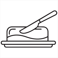 Butter dish with knife spreading butter on a slice of toast

