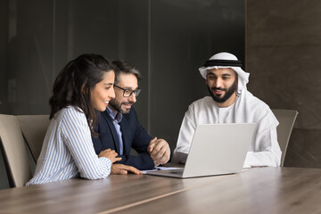 Muslim real estate broker meet customers use notebook on consultation