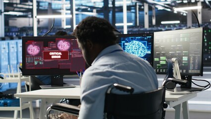 Overworked man in wheelchair upset by error warning popup while looking at server hub AI analytics metrics. Data center worker with disability irked by malfunction while using node tree tool, camera B