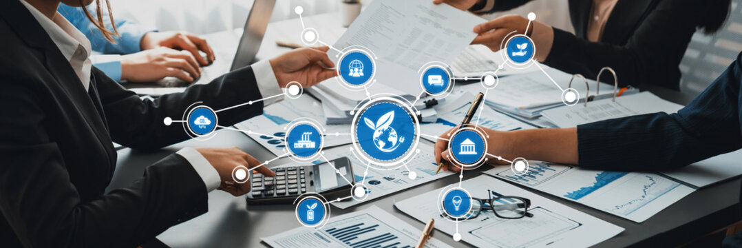 A dynamic business team collaborates on innovative strategies and projects, utilizing modern technology, analytics, and effective communication in a contemporary office setting. Amity