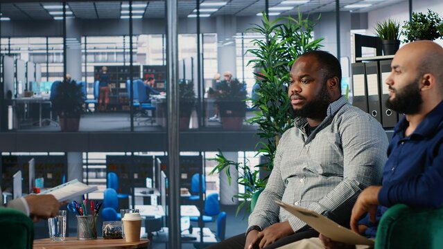 Office life showing frustration and dispute during a business discussion, with leaders are facing disagreement and workplace tension in a multicultural goal oriented company. Camera B.