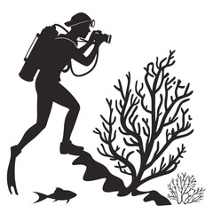 Diver photographing coral reef silhouette