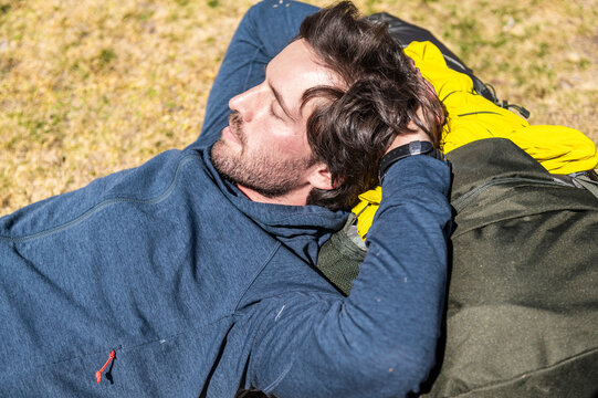 Solo hiker resting peacefully after mountain trek