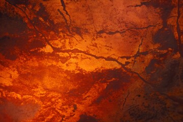 Obraz premium Glowing cracked lava rock texture surface