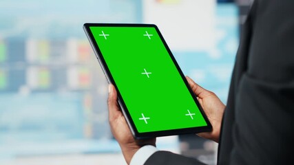 Business professional using isolated screen tablet app to analyze performance dashboards metrics. Woman evaluating annual report data KPIs using mockup digital device, camera B - Powered by Adobe