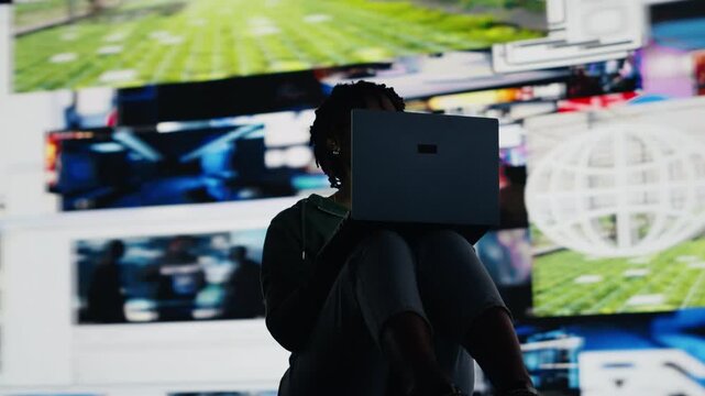 Teenager procrastinating online, browsing websites on laptop instead of doing school assignments. Lazy woman using notebook to have fun on internet instead of doing chores, camera B