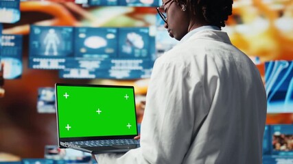Isolated screen laptop used by healthcare researcher analyzing medical data visualizations, doing disease prevention. Chroma key notebook used by scientist doing patient scans research, camera A - Powered by Adobe