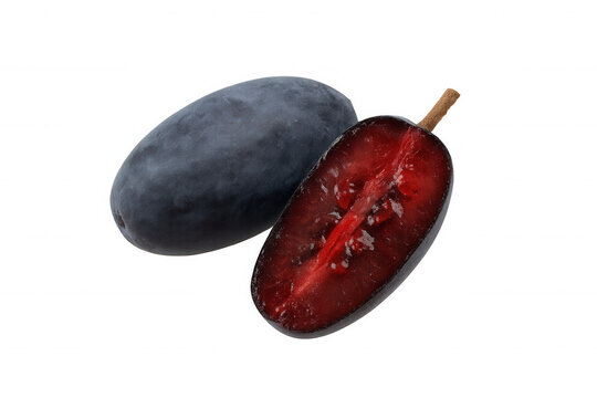 Haskap berry, one whole and one sliced showing ripe red flesh and seeds, isolated on a transparent background