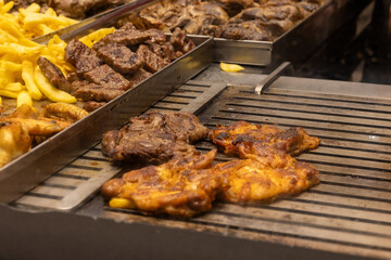Grilled Steaks and Chicken on the Restaurant Grill Station
