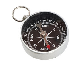 Round metal compass for navigation and orientation in outdoor adventures isolated on transparent background © Olzhas