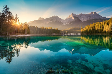 Impressive summer sunrise on Eibsee lake with Zugspitze mountain range. Sunny outdoor scene in German Alps, Bavaria, Germany, Europe. Beauty of nature