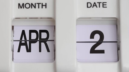 365 days vintage flip calendar time lapse | month and date in black letters on white background