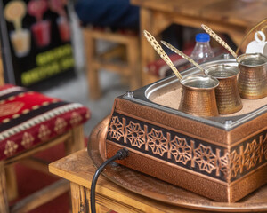 Close-Up of Turkish Coffee Brewed in Sand in a Cezve
